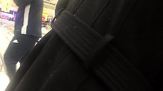 Striking amateur lady in fishnet stockings upskirt in public