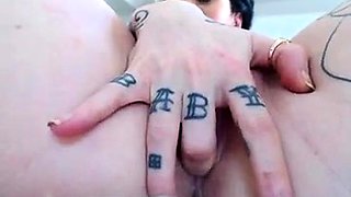 Tattooed girl with big boobs vibrates and fingers her cunt