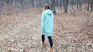 Exhibitionist girl undresses in the autumn forest