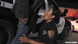 Officer Nicole Doshi is sucking Mick Blue's cock outdoors