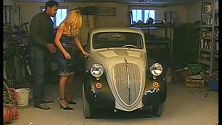 Blonde whore gets fucked by a black cock on the hood of the car