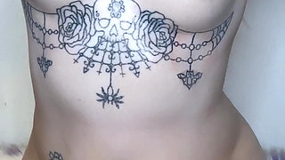 amateur tattooed blonde oils her pierced tits