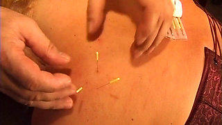 Busty Blonde MILF Submits to Intense Needle Play