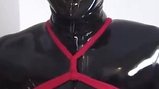 Mz27 - a Girl Bound in Latex Walks on a Treadmill