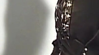 Corseted MILF in Mask Serves Hooded Masters Eagerly
