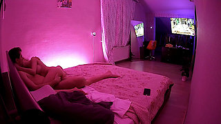 Kamila and Danildo cuddling in bed