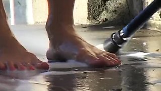 Getting Her Feet Dirty at the Car Wash