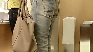 Japanese chick with hairy pussy pisses in a public toilet