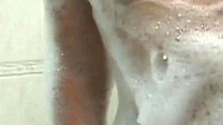 Mora gets excited while taking a hot bath and satisfies her hairy pussy by masturbating it
