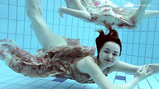 Mesmerizing underwater display featuring lovely ladies with natural breasts