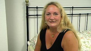 Blonde MILF Teases in Bed