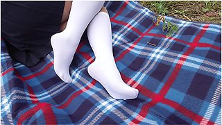 Schoolgirl In Uniform Shows Legs Feet Foot In White Knee Socks And Pantyhose Under Skirt