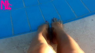 Barefoot Dangling in Swimming Pool Water
