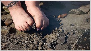 Feet In The Sand At The Beach