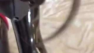 Mz15 - a Puppy Wearing a Latex Suit and Bound by a Red Rope.