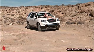 Man torments busty tits babes in a desert