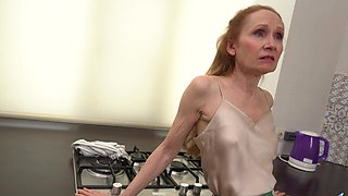 Red-haired granny Iren plays with her pussy using a sex toy in the kinkiest way