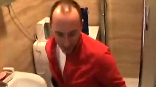 Footjob wife makes him lay down in the bathroom