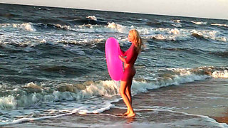 Hot naked blonde on the beach
