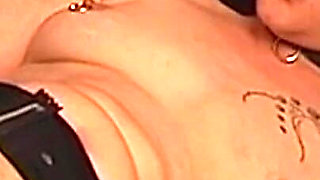 Tattooed Dom Fists Mature Blonde in Chains