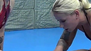 Two Tattooed Chicks Tickling Their Slave in the Gym