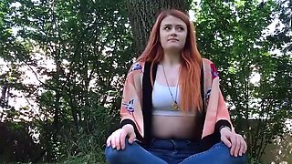 Amateur redhead plays with her fake penis outdoors