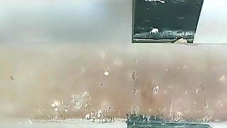 Turkish girl with headscarf who turns on the camera and puts on a show at the construction site