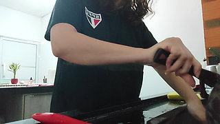 Woman teasing while washing dishes. She loves to transmit to the voyeurs on duty