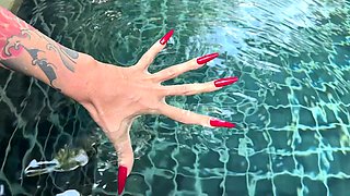 Long Red Nails and Long Fingers in Swimming Pool