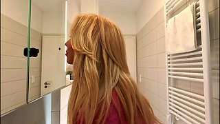 Super hot amazingly beautiful all natural big tits big ass blonde touches her pussy and panties under her skirt in the bathroom