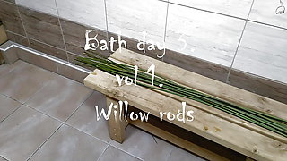 Femdom spanking husband with willow rods in the bath