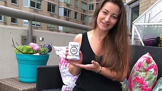 Funny brown haired girl in dark-hued top on balcony