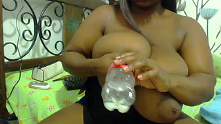 Black mom with gigantic tits sprays breast milk into bottle