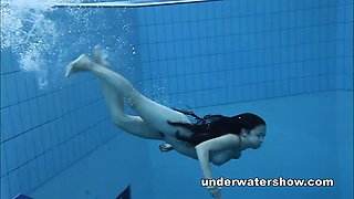 Cute Umora is swimming nude in the pool