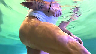Amazon Kandy Flexes Her Massive Biceps in Her Hotel Pool