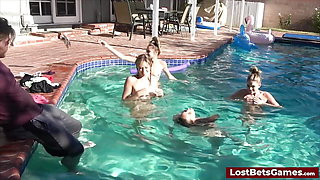 Derek is getting his cock sucked by all four wet girls in the pool