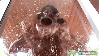 Soapy ebony Janet Jade plays with her wet pussy in the shower