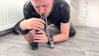 Sucking dildo in chastity and masturbation