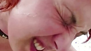 A Naughty Redhead Girl Stuffs a Big Cock in Her Mouth While Rubbing Her Cunt