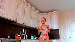 Blonde Solo Female in BDSM Gear Performs a Striptease