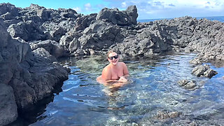 Nudist Girl Swimming Naked in the Natural Pool Outdoor