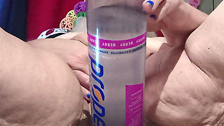 Big Bottle Plugged Clit Cunt