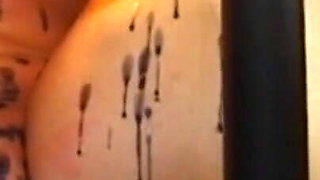 Humiliating wax play in the cage