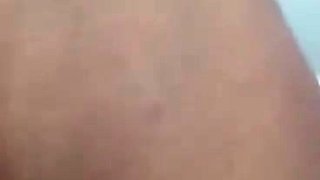 Pink labia close up of naive brunette playing with her name