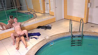 Young hottie gives head to older stud in steamy pool scene