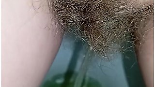 Bushy Pussy Girl Peeing In The Toilet With A Sanitary Pad In Her Panties