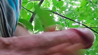 Hard handjob in the forest. Throbbing and lots of cum