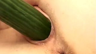 Lewd college girl smashes her cunt with a long cucumber