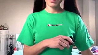 Skinny teen brunette masturbating with toy
