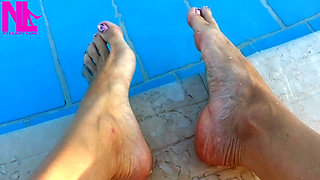 Barefoot Dangling in Swimming Pool Water